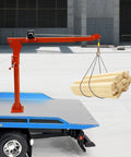 Heavy Duty 1100 Lb Truck Mounted Crane Hoist W/ 12V Electric Winch lifting wooden beams from a blue truck bed in a construction area.