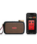 Ultra Portable 5W Smart Guitar Amp With Bluetooth Speaker Headphone Amp And Mobile App For Electric Acoustic Or Bass Guitars 33 Amps 43 Effects Custom Presets 50,000 ToneCloud Tones next to smartphone displaying app interface