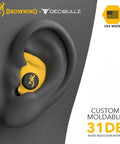 Decibullz Custom Molded Earplugs For Shooting With 31 Decibels NRR in ear, yellow with logo, USA made, hearing protection