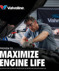Mechanic working under hood with Valvoline sign, promoting Non Detergent SAE 30 Conventional Motor Oil 1 Quart With Beefed Up Anti Wear Protection