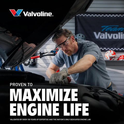 Mechanic working under hood with Valvoline sign, promoting Non Detergent SAE 30 Conventional Motor Oil 1 Quart With Beefed Up Anti Wear Protection