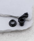 DRH WMN112 Derailleur Hanger Dropout For Cervelo C3 C5 R3 R5 CVR18 3 Gear Mech Replacement Made From 6061 Aluminum With Black Anodized Finish Bolt On Install Hardware Included Durable Hanger For Quick Easy Road Bike Gear Fix on concrete surface showing black anodized hanger and bolt insert