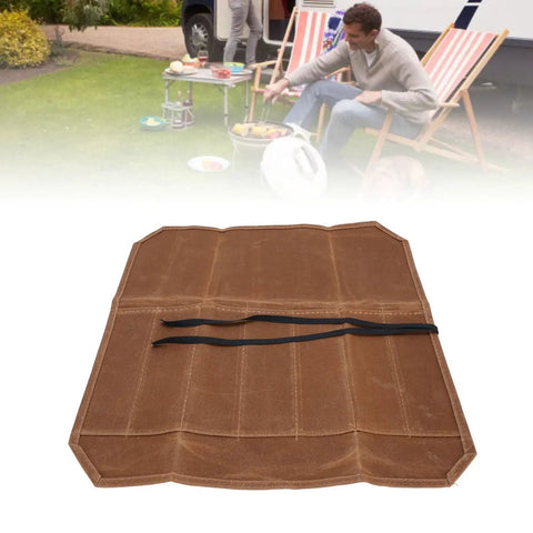 Open Seven Slot Waxed Canvas Chef Knife Roll Bag For Outdoor Camping And Travel with visible compartments in a backyard setting.