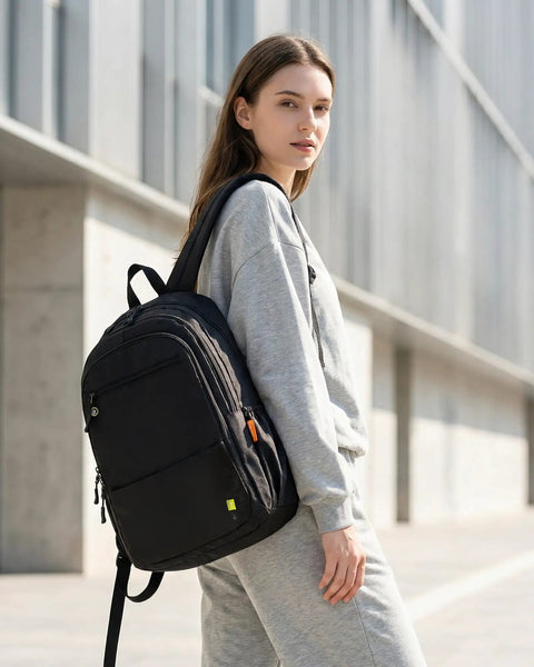 Underseat Personal Item Backpack For Travel And College Carry On Flight Approved By Ryanair, woman outdoors with black backpack.