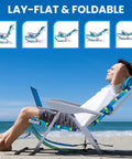 Portable Beach Chair For Adults With 5 Position Recline And Lay Flat Option Headrest And Cup Holder Heavy Duty 350 Lb Capacity Folding Camping Chair In Ocean Stripe For Outdoor Beach Camp And Backpack Carry shown on beach with reclined man relaxing