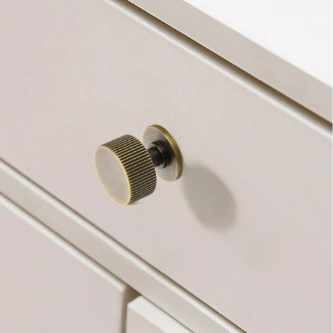 Close-up of Antique Brass Cabinet Knob Set 5 Pack Solid Brass Dresser Drawer Knobs One And One Tenth Inch Rustic Furniture Pull