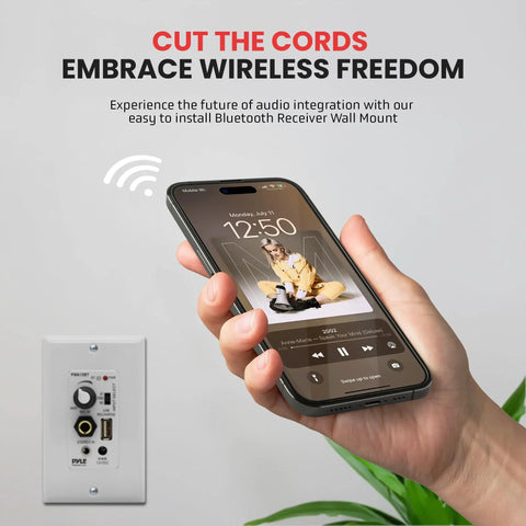 Person holding smartphone showing music app, near Wireless Bluetooth In Wall Audio Receiver With Built In 100W Amplifier And USB Microphone Aux.