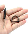 Hand holding Durable U Shape D Ring Screws Set For DIY Leather Strap Craft And Purse Replacement With Included Screwdriver Easy Install Alloy Hardware In Black Finish For Belts Bags And Accessories No Fuss Quick Swap.