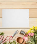 Boss Grade Flower Wrapping Paper Kit 200 Pieces 21x14 CM White Paper For Florists with scissors, flowers, and tools on wooden surface