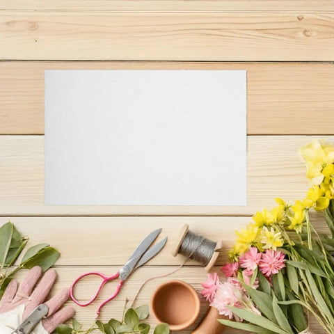 Boss Grade Flower Wrapping Paper Kit 200 Pieces 21x14 CM White Paper For Florists with scissors, flowers, and tools on wooden surface