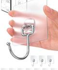 Hand holding Ten Pack All Purpose Heavy Duty Adhesive Hooks For Hanging Up To 37 Pounds Rustproof Nano Gel Pads And Stainless Steel Hooks