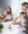 Brushed Nickel Bathroom Faucet With Single Handle Basin Mixer for modern vanity sink, in use with family brushing teeth.
