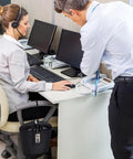 Office scene with Portable Indoor Outdoor Lock Box Safe With 3 Digit Combo And Key Access secured to desk