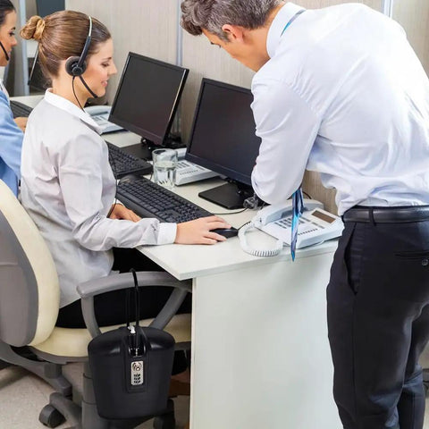 Office scene with Portable Indoor Outdoor Lock Box Safe With 3 Digit Combo And Key Access secured to desk