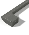 Close-up of a gun metal 10-inch center cabinet handle from the Etna Collection, showing solid stainless construction and screw hole.