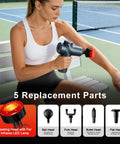 Woman using Heat Massage Gun For Pain Relief With Deep Tissue Back Massager Mini Percussion Massage Gun For Home Office Travel.