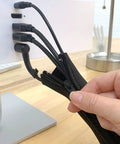 Zippered Cable Sleeve 24x4 Inches, 4-Pack Black organizing cords behind a computer monitor on a desk