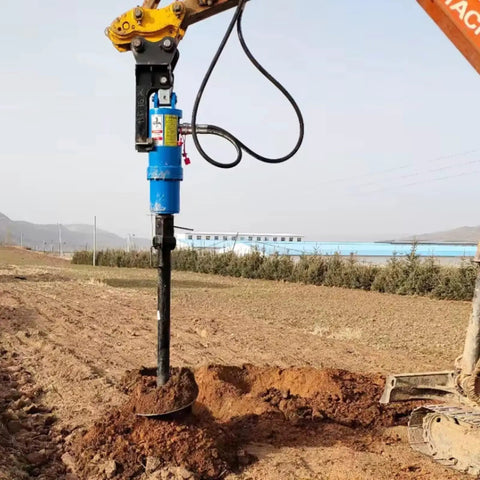 Heavy Duty Excavator Earth Auger Drive Unit With 2000Nm Hydraulic Power in operation on grassy field