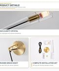 XYDikssn Crystal Wall Sconces, Brushed Gold Brass Wall Lights with Clear Crystal Glass, showing brushed brass body and crystal lamp details.