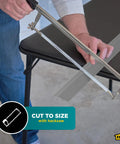 Person cutting Pewter Aluminum Carpet Trim 2 In By 36 In with saw on table, showing easy trim customization.