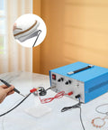 Pro Grade 390W Electric Spot Welder Kit with 80A handheld torch, foot pedal, for jewelry repair on a marble table.