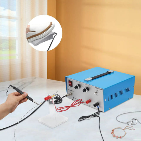 Pro Grade 390W Electric Spot Welder Kit with 80A handheld torch, foot pedal, for jewelry repair on a marble table.