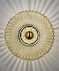 Awsinil Fluted Glass Wall Sconce, Modern Iron Round Decorative Wall Light with ribbed glass and soft radiating light effect.