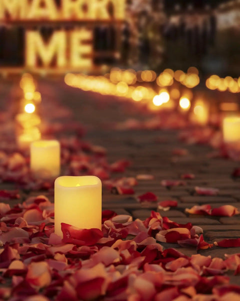 Remote Control Flameless Votive Candles 12 Pack Flickering Battery Operated LED Tealight Candles For Cozy Wedding And Christmas Decor Amber Yellow Batteries Included glowing among rose petals