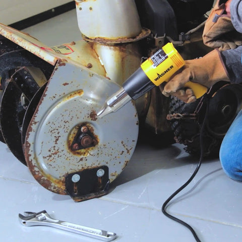 Using Dual Temp Heat Gun Kit with 750 Degrees F and 1000 Degrees F on rusted bolt, ideal for DIY home projects.