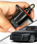 Hand holding Direct Fit Car Idle Air Control Valve And Throttle Response Regulator for engine idling and gas pickup.