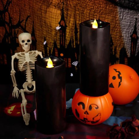 Black flameless LED candles with moving flame effect, 7-inch pillars, set of 2, with Halloween decor and remote timers, battery operated.