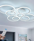 41 Inch Modern LED Ceiling Light With Remote Dimmable Eight Ring White Flush Mount Fixture illuminating a living room ceiling