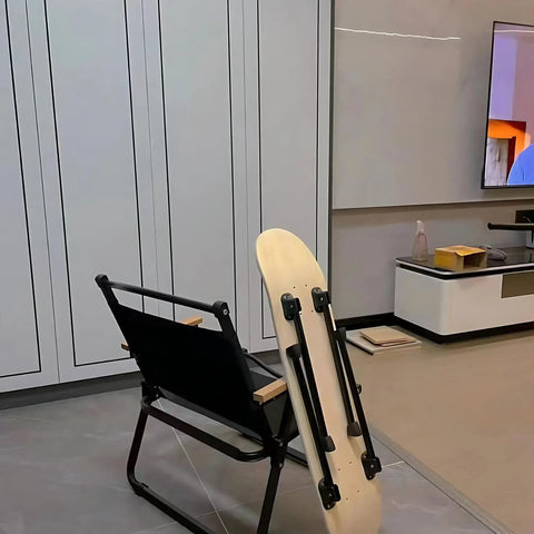 Sweet Set Of Four Portable Folding Table Legs Crafted From Skateboards And Longboards With Protective Floor Pads next to a black chair.