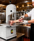 Chef using Beastly 2500W Meat Saw With 8 Stainless Steel Blades, 110V, 0-7.8 Inch Cutting, Countertop Bone Saw in kitchen