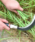 Person using Two Pack Manganese Steel Weeding Sickle Set For Easy Yard Work, Weed Cutting And Harvesting, Durable Grass Cutter close-up