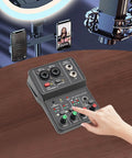 User operating Two Channel DJ Mixer For Laptop Tablet And Phone With 16Bit 48KHz Audio Resolution Portable Pro Mixing Console