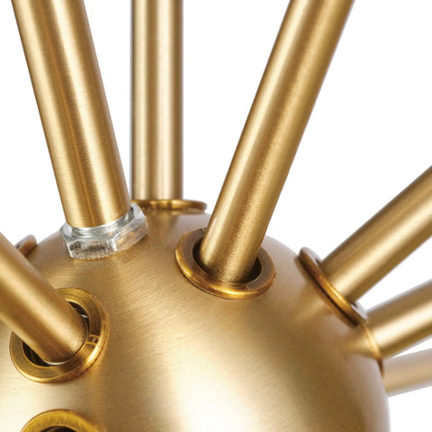 Close-up of matte brass rods on Novogratz Celeste 4 Light Chandelier In Matte Brass Dope Modern Glam Ceiling Fixture With Open Frame Design.