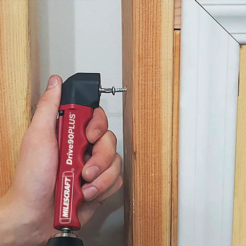 Drive90Plus Right Angle Drill Attachment for tight spaces used for screwing in narrow area beside door frame.