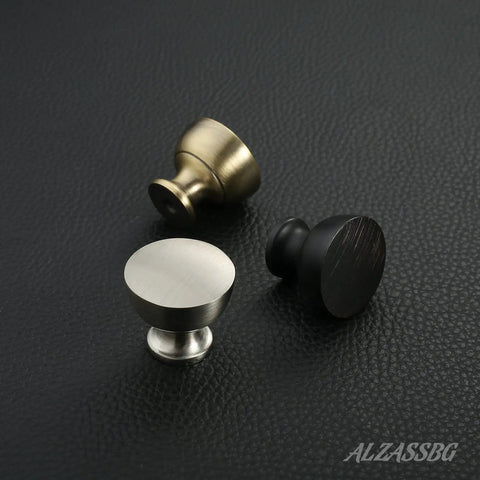 Three satin nickel cabinet knobs in various finishes, part of 10 Pack Brushed Satin Nickel Cabinet Knobs Flat Round AL6013SN.