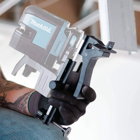 Wall and Ceiling Mount Bracket for Laser Levels, Drop Ceiling Clamp held by a person in gloves, showing screw attachment detail.