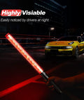 4 Pack 21 Inch LED Traffic Wands With Two Flashing Modes, Safety Light Baton in use near a car at night