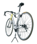 Portable Bike Stand For On The Go Tune Ups with a bike, compact foldable display stand fits 26 inch and 700C wheels, lightweight aluminum.