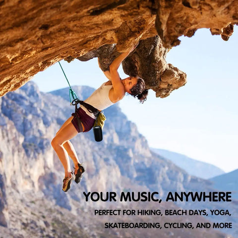 Woman rock climbing with Compact Waterproof Portable Bluetooth Speaker That Goes Hard With Deep Bass attached to harness.