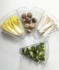 Top Shelf Lazy Susan Corner Cabinet Bins 8 Pack Clear Heavy Duty Plastic Wedge Storage Trays With Rugged Handles Bpa Free Kitchen Pantry Organizer For Spices And Fresh Groceries filled with vegetables.