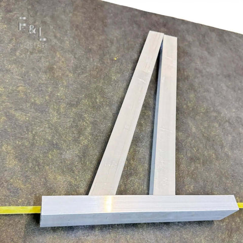 Heavy Duty Aluminum Square Duct Angle Cutting Guide with exact 15 and 22.5 degree markings on a surface, for HVAC ductwork and sheet metal.