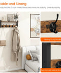 Rustic Wood Wall Shelf With Five Metal Hooks Coat Rack For Your Entryway Hallway Bathroom Mudroom And Bedroom Keeps Hats Coats Purses Towels Sorted And Chic In Rustic Brown And Black Finish shown in a room with hanging clothes and reinforced hooks.