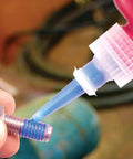 Applying Blue Removable Thread Locker, Medium Strength 242 Series, 10 mL Bottle to bolt threads to prevent loosening from vibration.