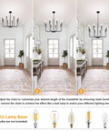 8 Light Matte Black Farmhouse Chandelier With Adjustable Height For Dining Room Living Room Kitchen Island And Bedroom, Classic Candle Stem Design, shown from various hanging heights, in a hallway setting.