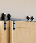12 Foot Bypass Sliding Barn Door Hardware Kit With Single Track For Double Doors, view of installed heavy duty steel rails and pulleys