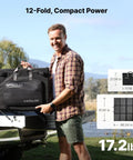 Person holding 440W Portable Solar Panel System with Foldable Solar Bag, showing compact foldability and weight.